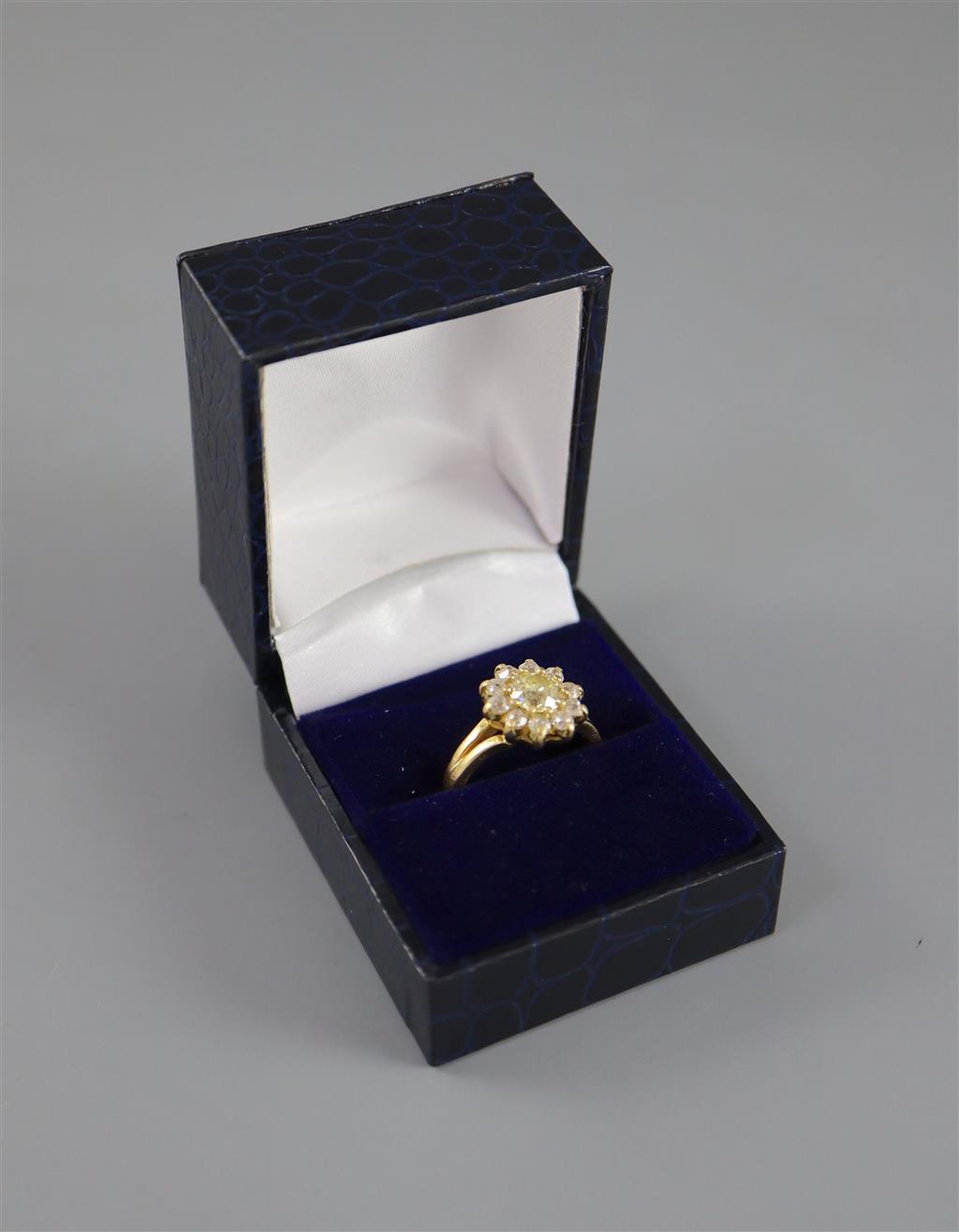 A modern 18ct gold and diamond cluster ring,